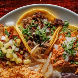 a plate of Mexican food and street tacos