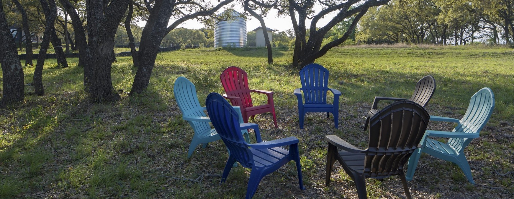 Adirondack chairs in the woods