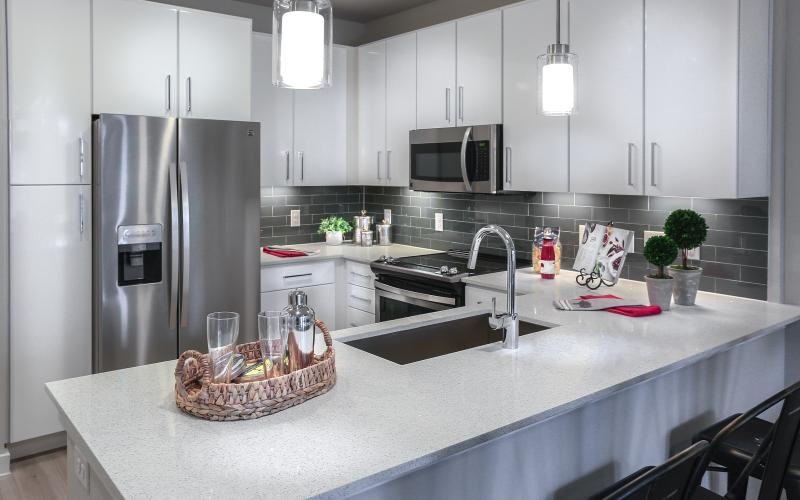 a kitchen with white cabinets