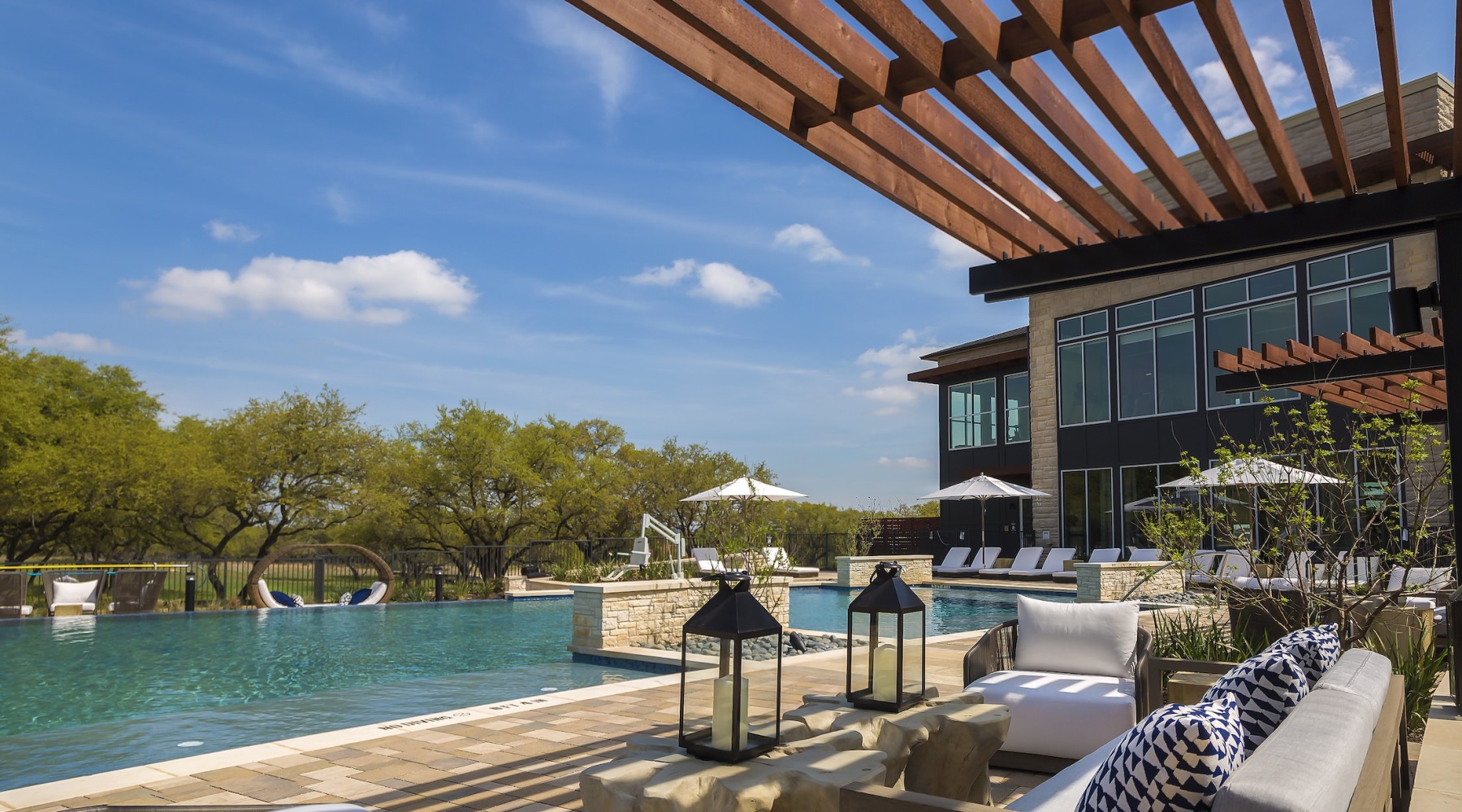 Resort-style swimming pool with lounge seating